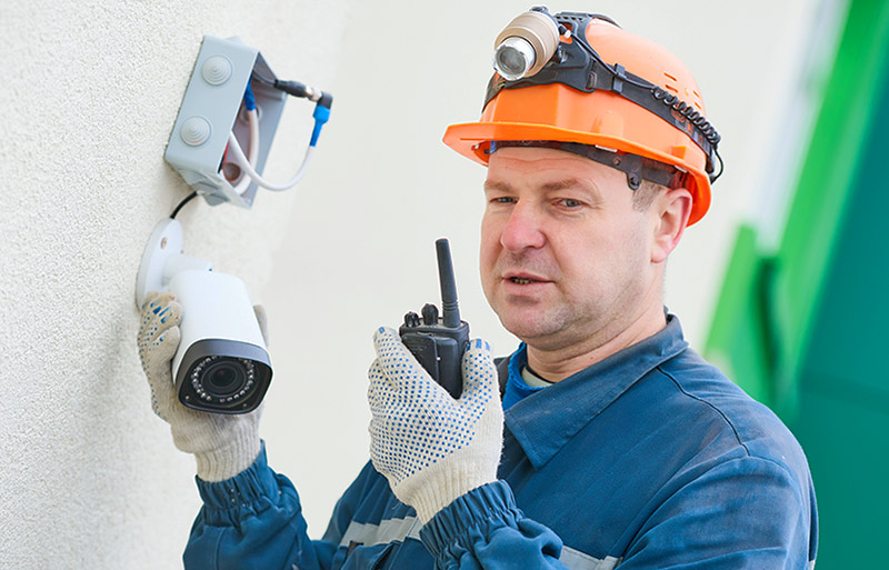 Gates Security - Technician Installing Security Camera